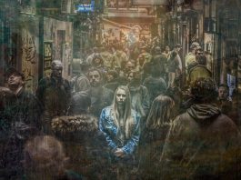 dull crowd with glowing woman standing out